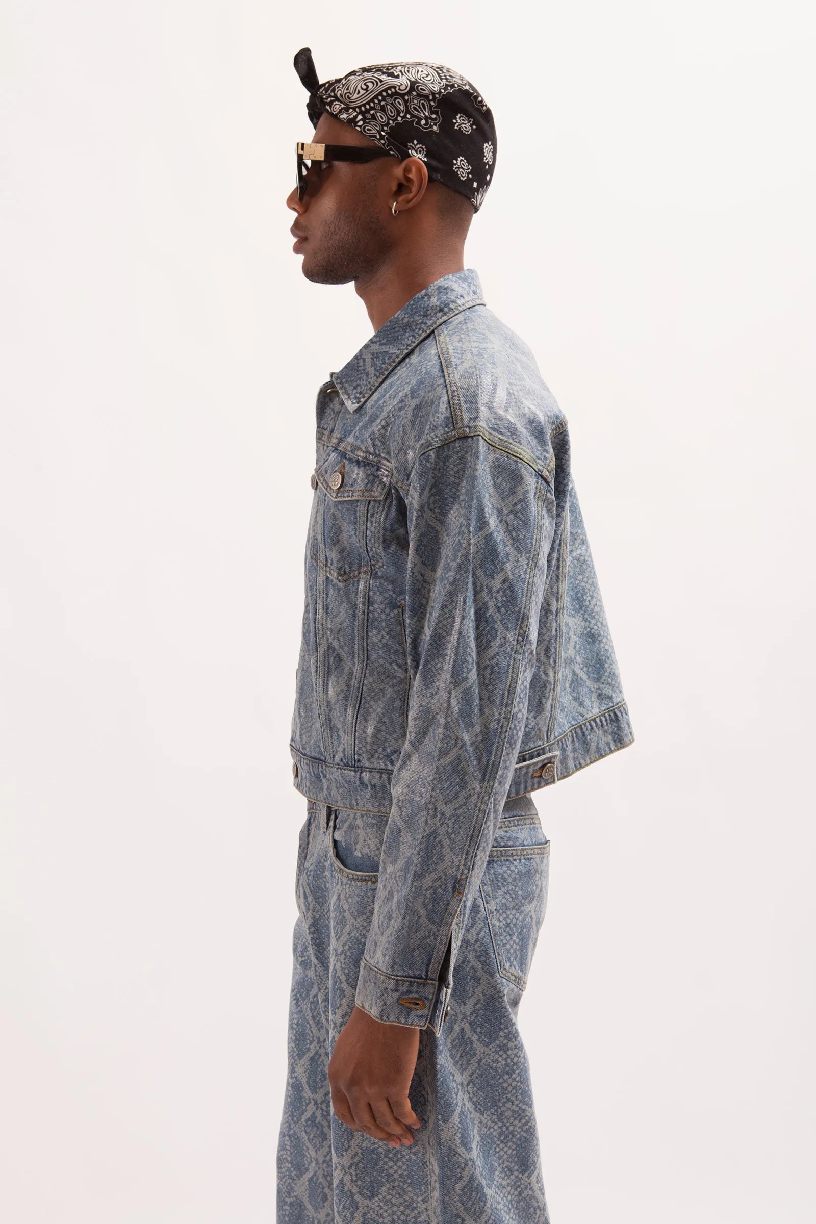 HURRICANE- SNAKE SKIN LASER PRINTED CROPPED TRUCKER JACKET WITH SEE THROUGH COATING