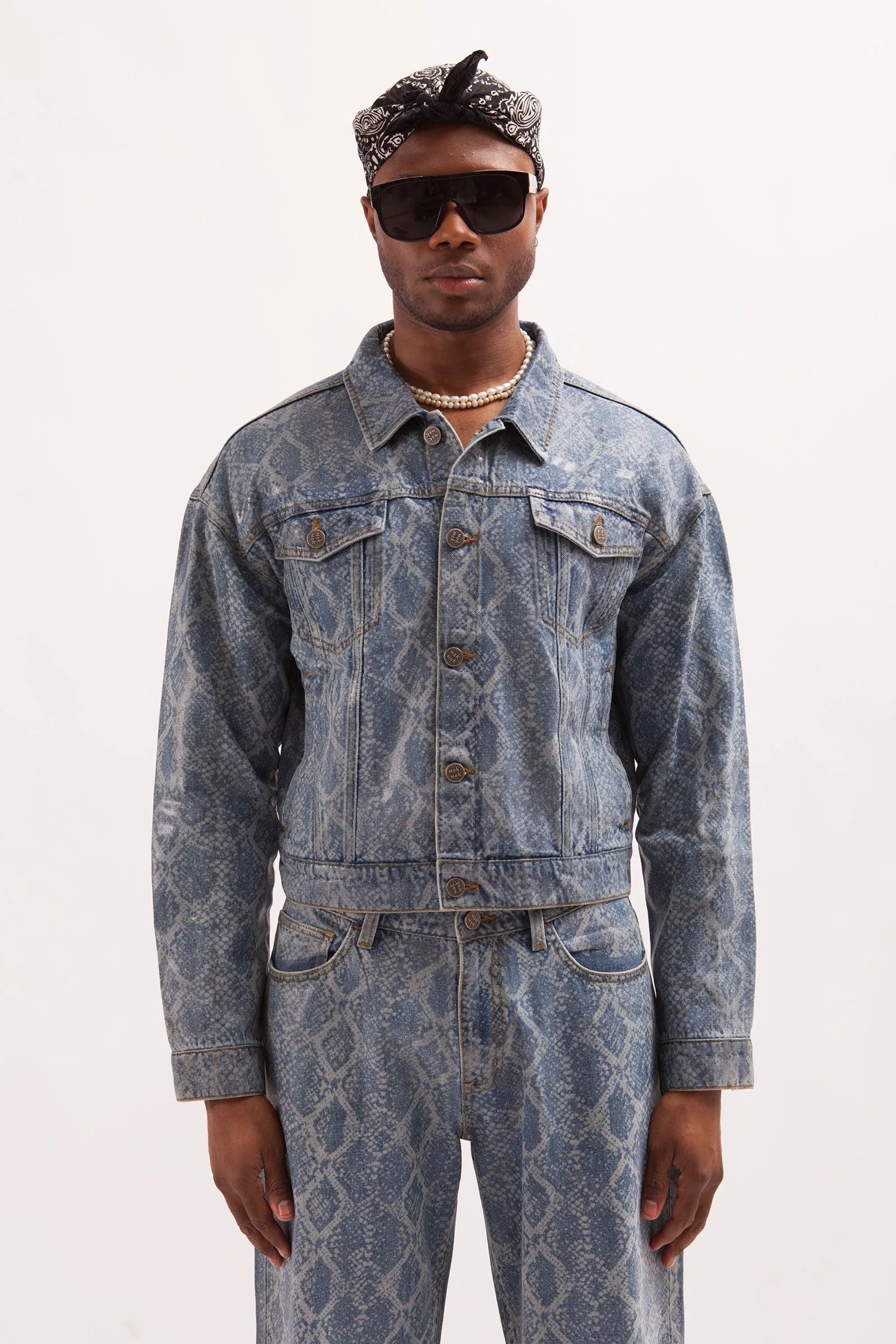 HURRICANE- SNAKE SKIN LASER PRINTED CROPPED TRUCKER JACKET WITH SEE THROUGH COATING