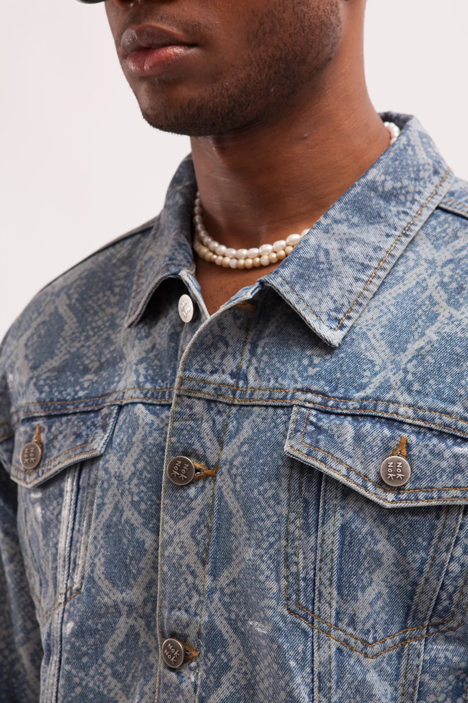 HURRICANE- SNAKE SKIN LASER PRINTED CROPPED TRUCKER JACKET WITH SEE THROUGH COATING
