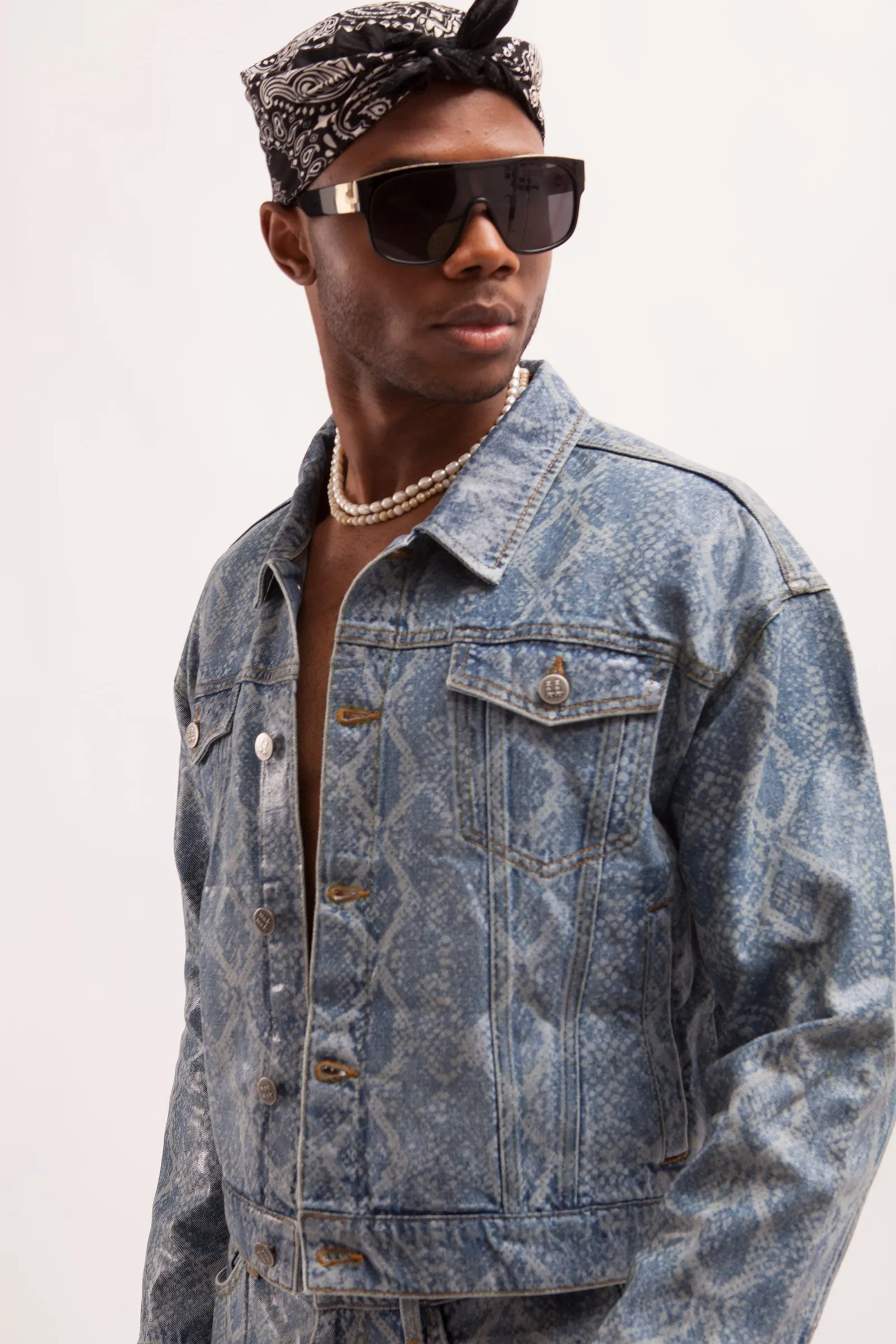 HURRICANE- SNAKE SKIN LASER PRINTED CROPPED TRUCKER JACKET WITH SEE THROUGH COATING