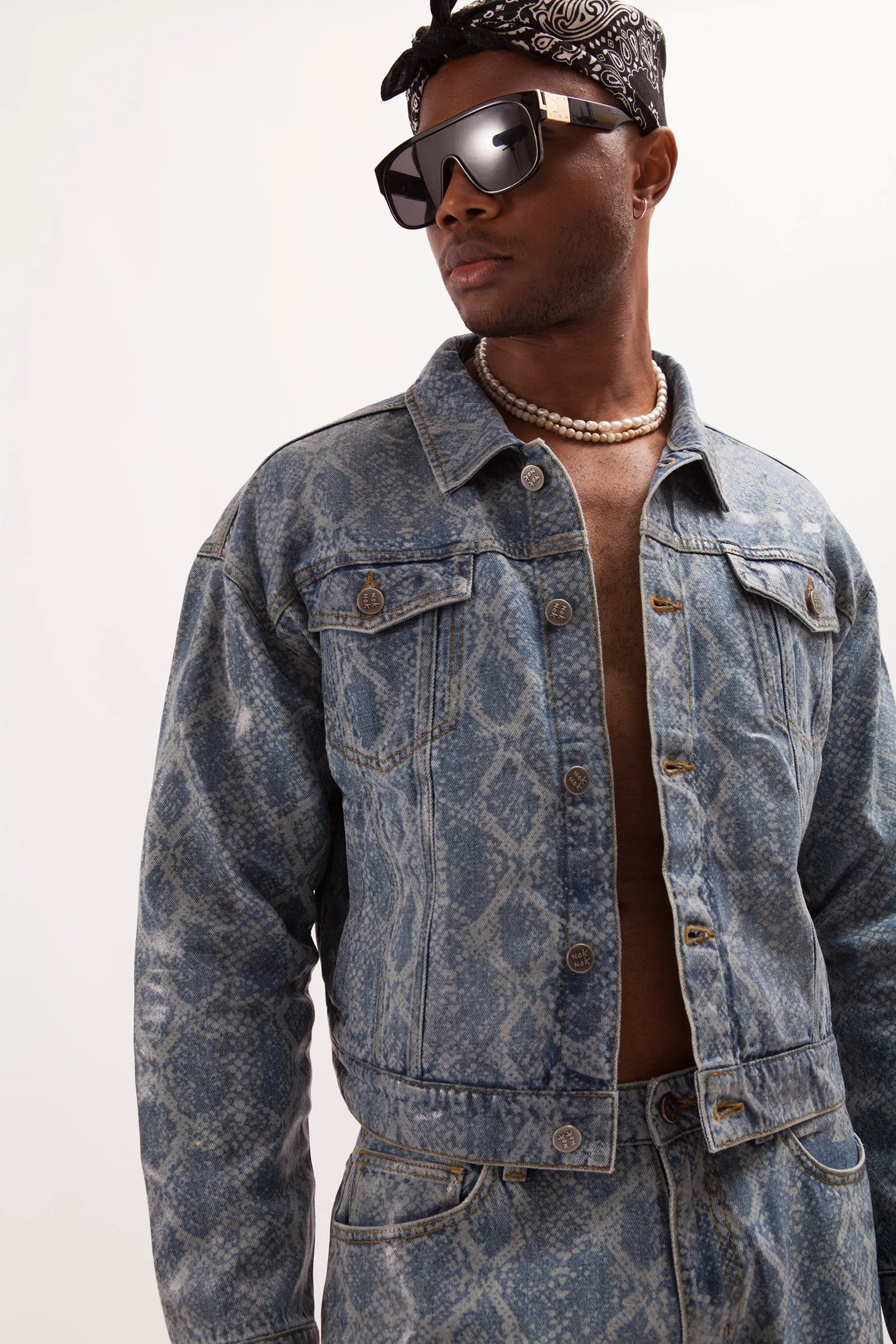 HURRICANE- SNAKE SKIN LASER PRINTED CROPPED TRUCKER JACKET WITH SEE THROUGH COATING