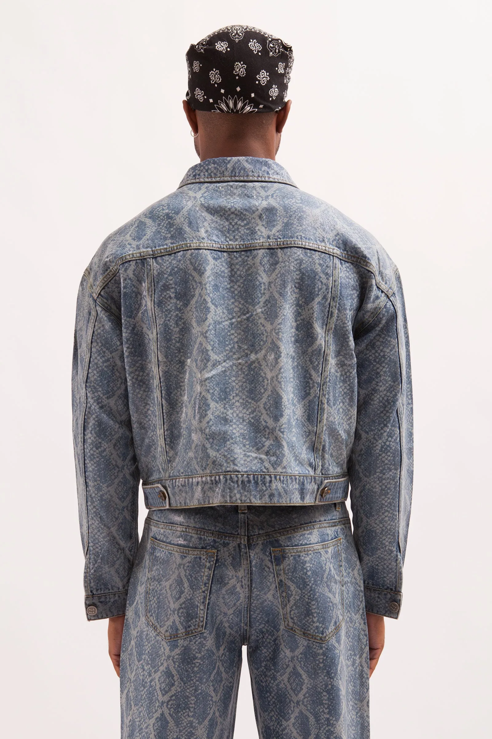 HURRICANE- SNAKE SKIN LASER PRINTED CROPPED TRUCKER JACKET WITH SEE THROUGH COATING