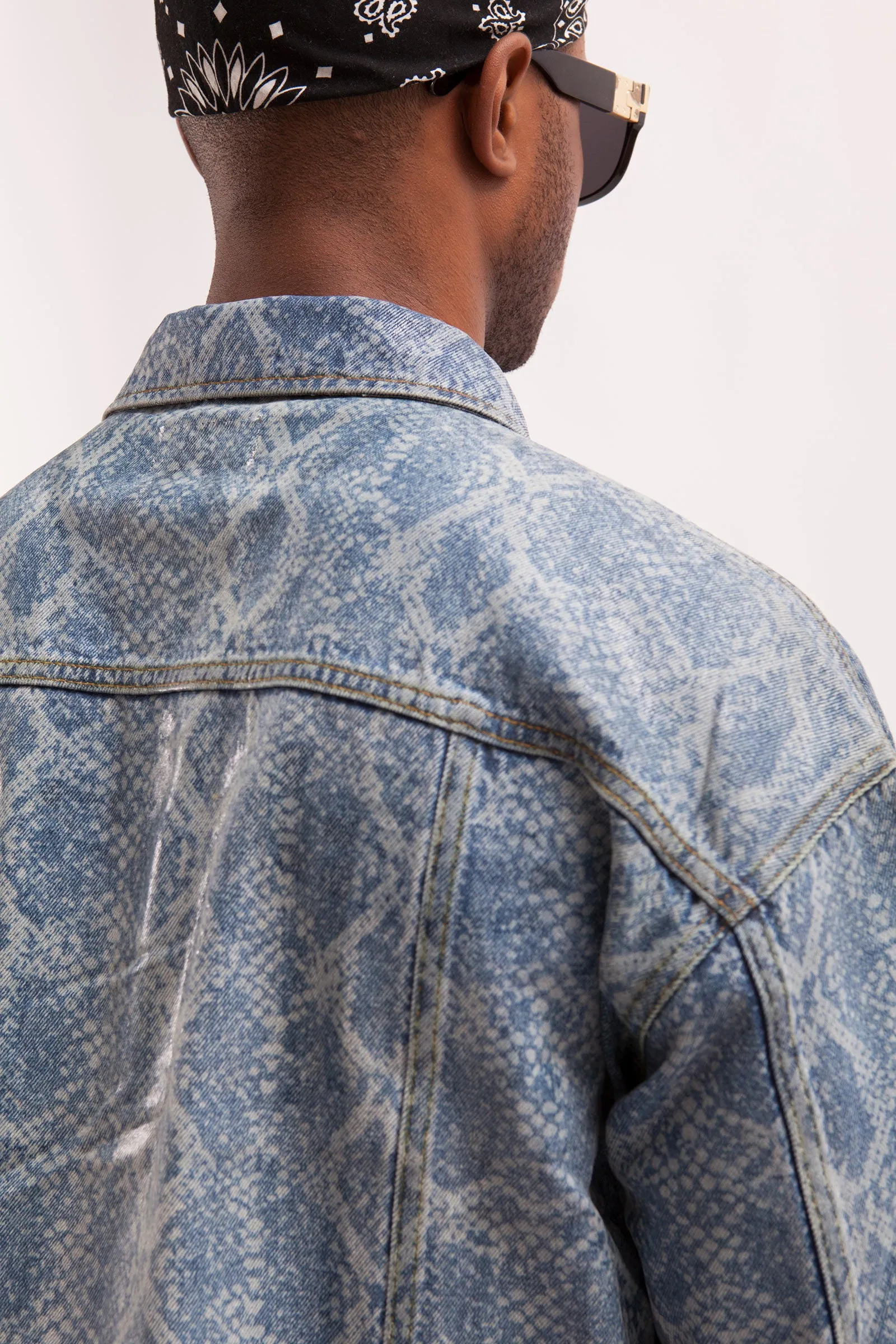 HURRICANE- SNAKE SKIN LASER PRINTED CROPPED TRUCKER JACKET WITH SEE THROUGH COATING