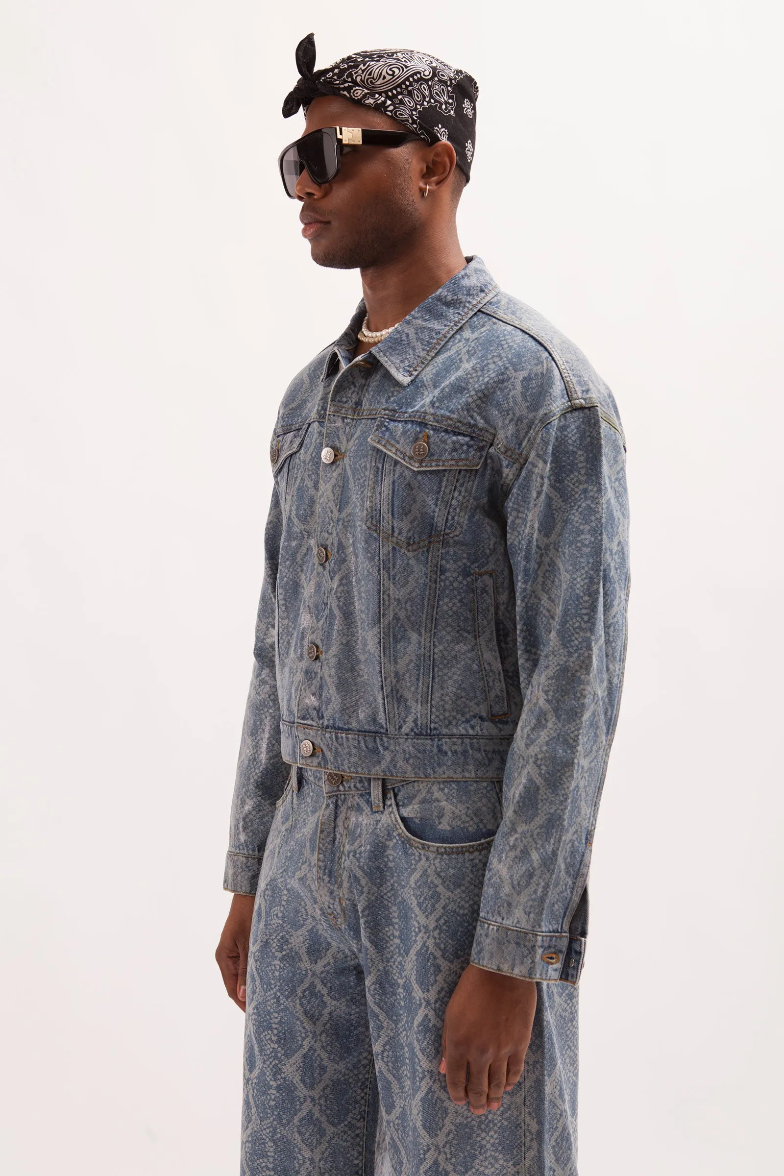 HURRICANE- SNAKE SKIN LASER PRINTED CROPPED TRUCKER JACKET WITH SEE THROUGH COATING